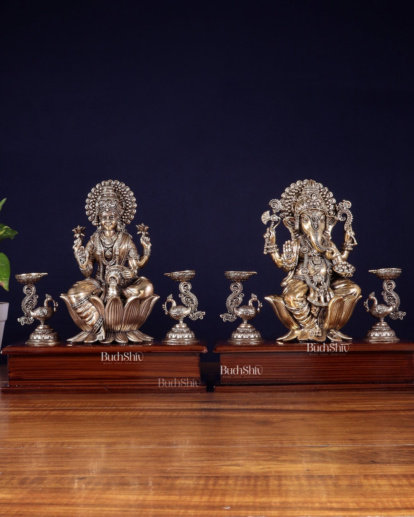 Brass Superfine Ganesh–Lakshmi Pair with Twin Peacock Lamps on Wooden Base – 9.5 Inch - Sama Homes Idol - Brass Sculpture