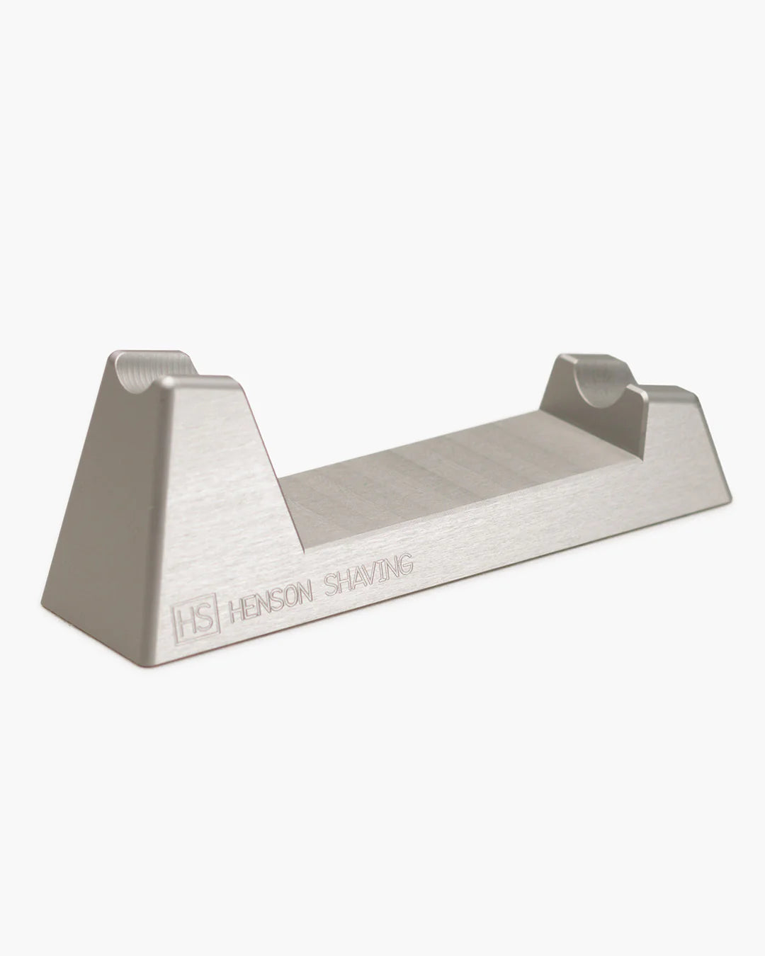 Metal shaving stand with 'Henson Shaving' branding on a white background