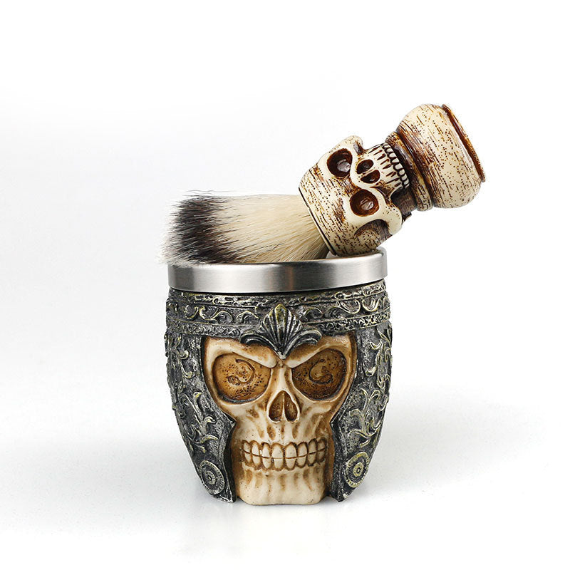 Skull-themed shaving brush and holder on a white background