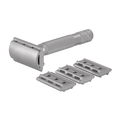 Silver safety razor with three razor heads on a white background