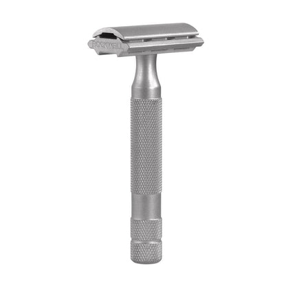 Silver safety razor on a white background