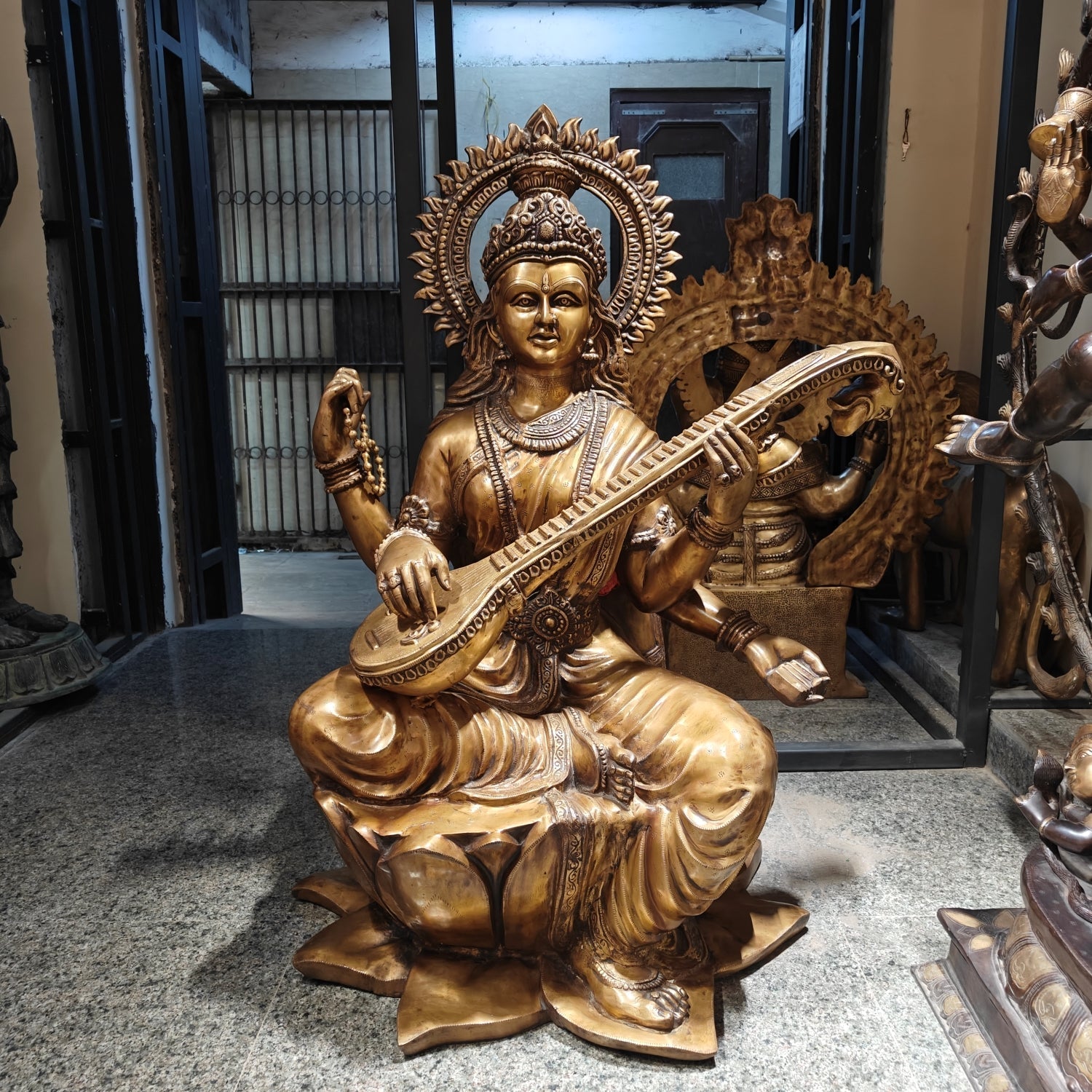 Brass Large Size Goddess Saraswati Idol Seated On Lotus Antique Finish 53 Inches - Eco-friendly - Sama Homes