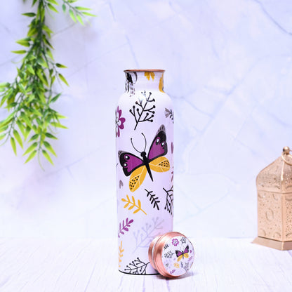 Decorative water bottle with butterfly design on a light background