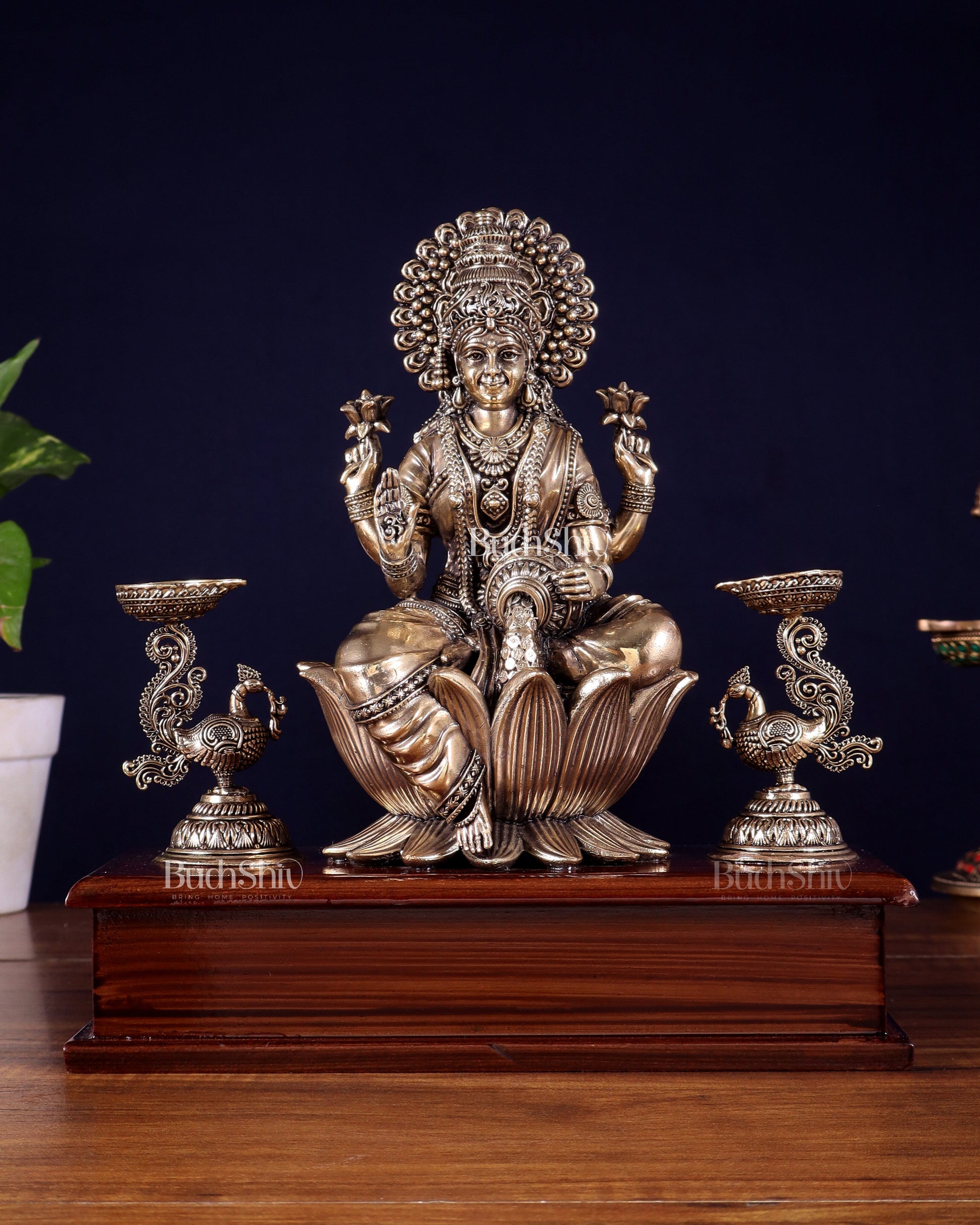Brass Superfine Goddess Lakshmi Idol with Twin Peacock Lamps on Wooden Base – 9.5 Inch - Sama Homes Idol - Brass Sculpture - Eco-friendly - Sama Homes