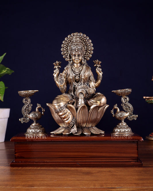 Brass Superfine Goddess Lakshmi Idol with Twin Peacock Lamps on Wooden Base – 9.5 Inch - Sama Homes Idol - Brass Sculpture