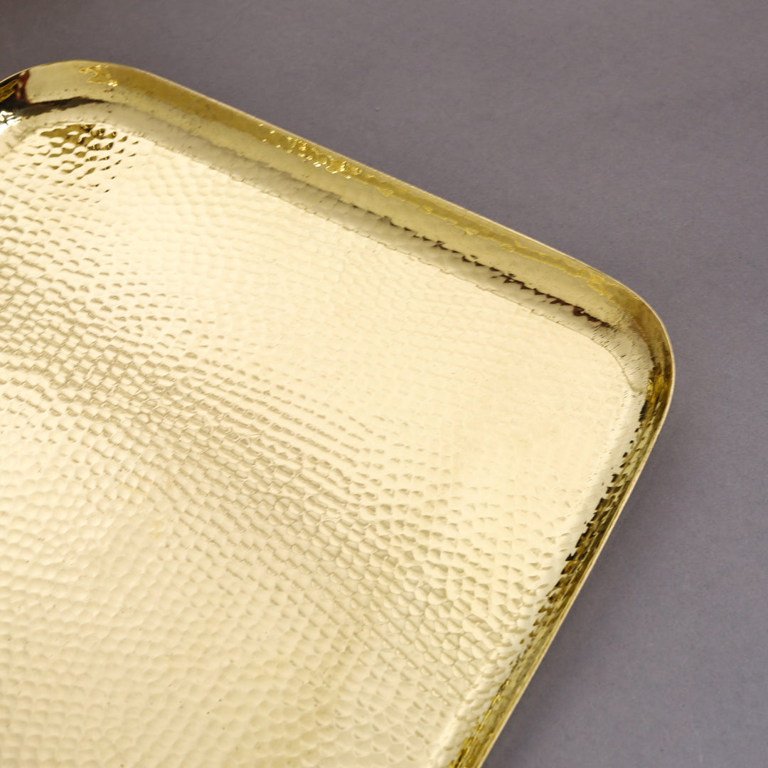 Gold textured rectangular tray on a gray background