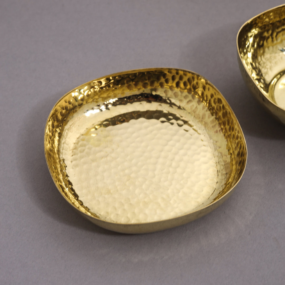 Gold textured bowl on a gray background