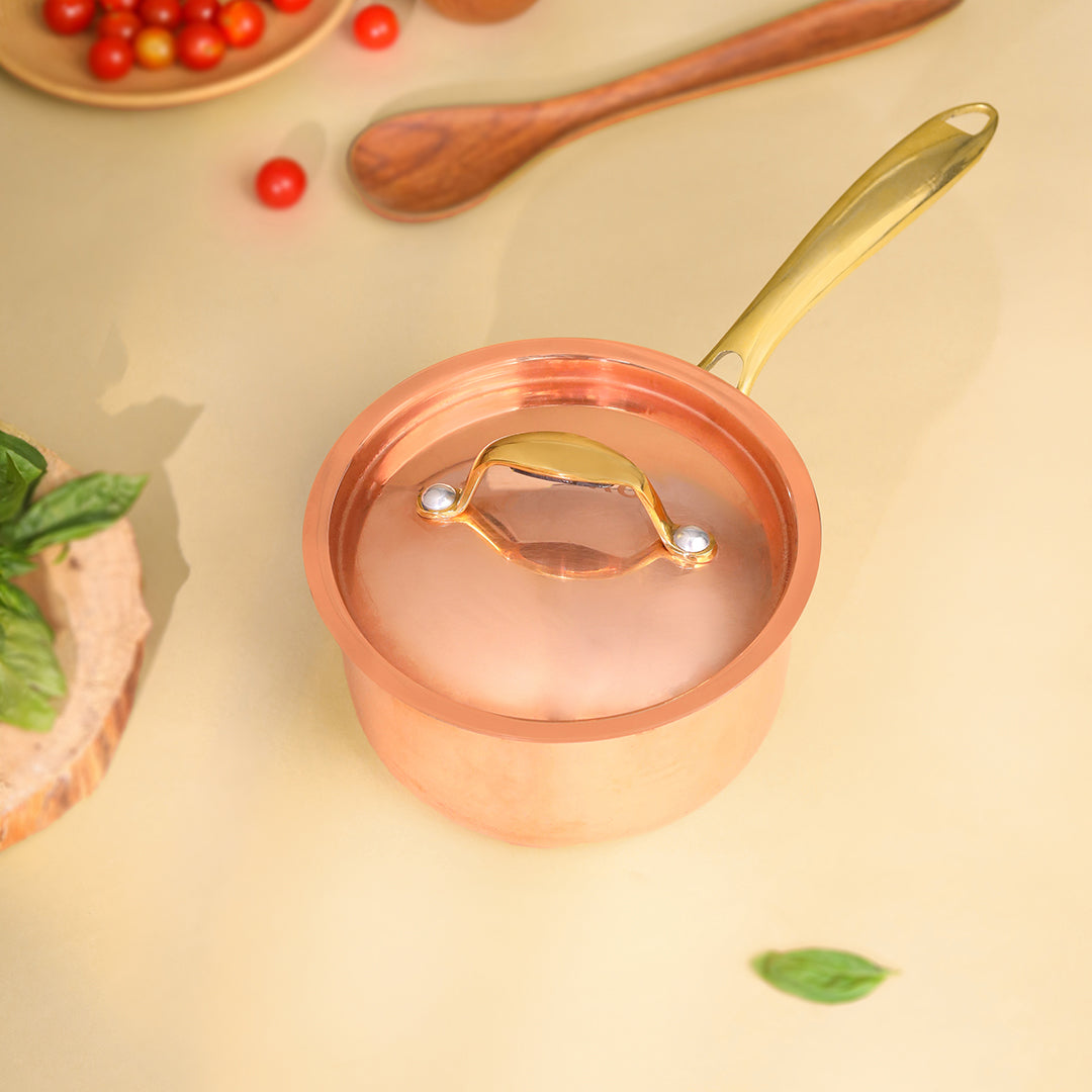Copper saucepan with a gold handle on a beige background - Eco-friendly - Sama Homes