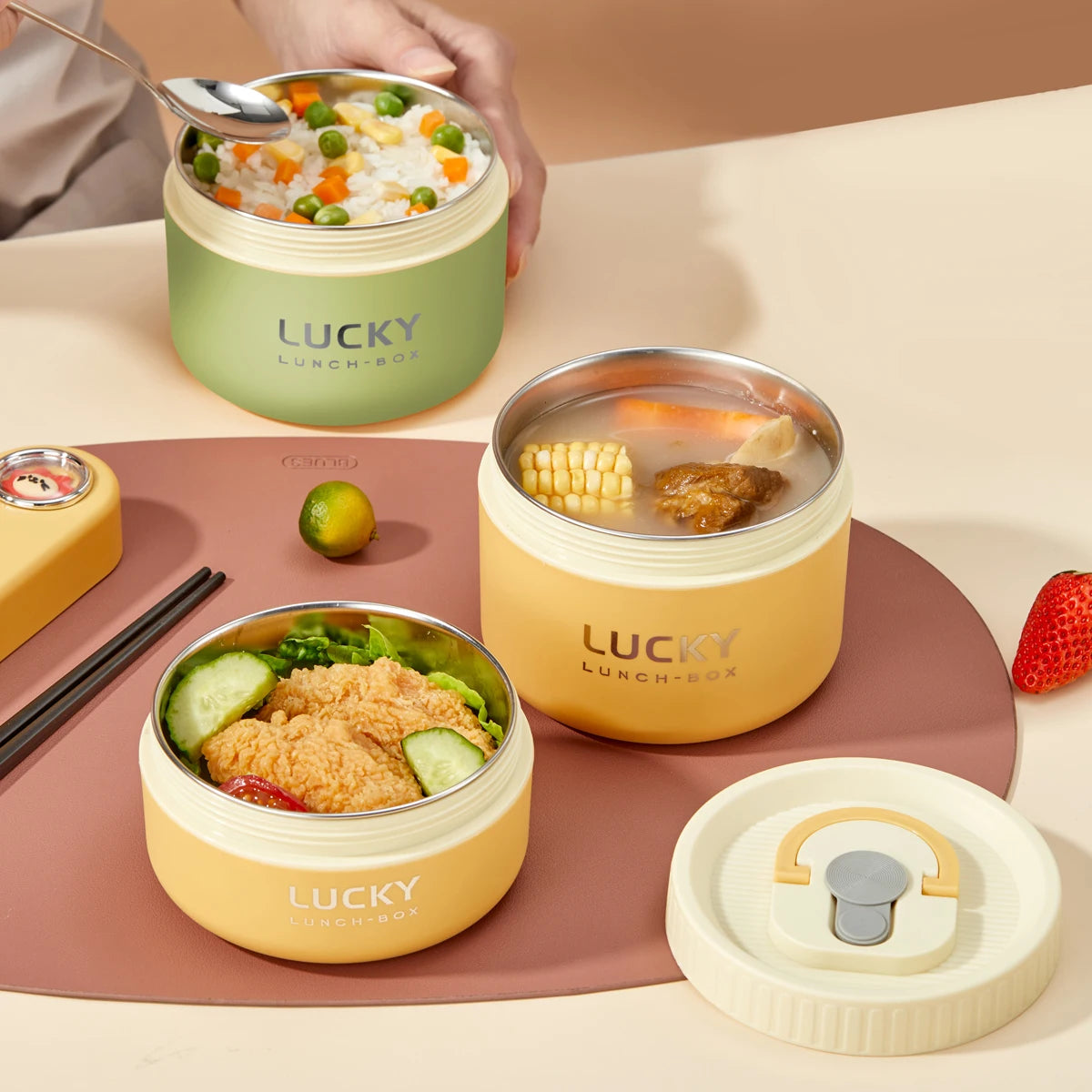 Three 'LUCKY' lunch boxes with different contents on a table. - Image 2