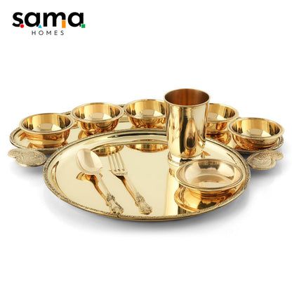 Handcrafted brass dinnerware set, showcasing traditional Indian metalwork.